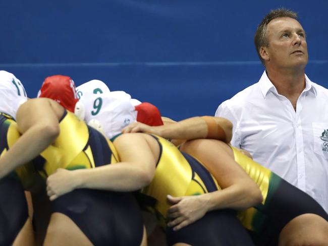 Australia's coach Greg McFadden looks on as players prepare for the game during women's water polo quarterfinal match against Hungary at the 2016 Summer Olympics in Rio de Janeiro, Brazil, Monday, Aug. 15, 2016. (AP Photo/Sergei Grits)