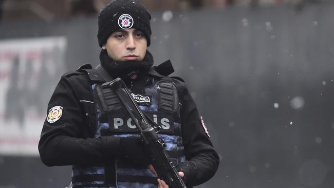 A Turkish police officer stands guard at the Reina nigh club, one of the Istanbul's most exclusive party spots. Picture: AFP/Yasin Akgul