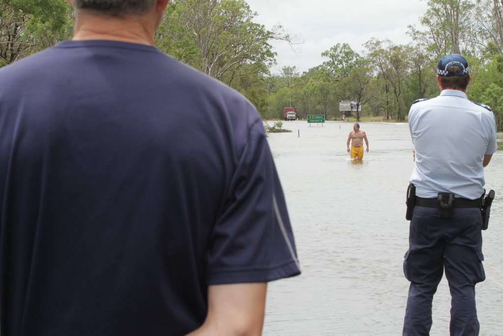 A man swimming in flooded Saltwater Creek was questioned by police. Photo: Robyne Cuerel / Fraser Coast Chronicle. Picture: Robyne Cuerel