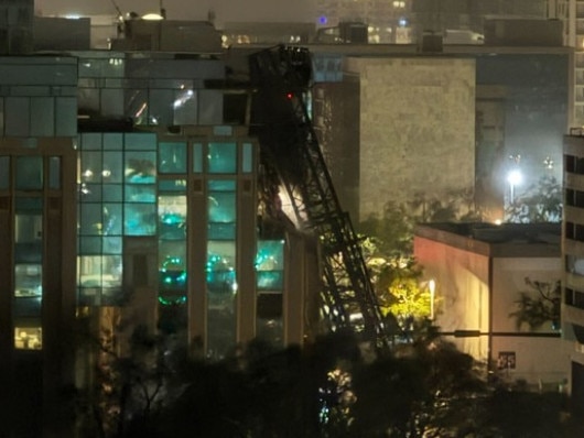 A crane in the middle of St. Petersburg has come tumbling down as Hurricane Milton lashes the city. Picture: YIMBY St. Pete