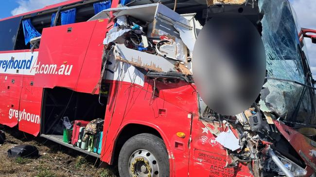 Photographs taken in the immediate aftermath of a horror fatal Greyhound passenger bus crash at Gumlu on the Bruce Highway south of Ayr on Sunday. The bus driver, picture, miraculously survived. The bus carrying 33 passengers was travelling north when it collided head on with a caravan being towed by a four-wheel drive driven by an elderly couple. Three passengers on the bus were killed while two others remained in critical conditions in Townsville University Hospital on Monday morning. Picture: Supplied