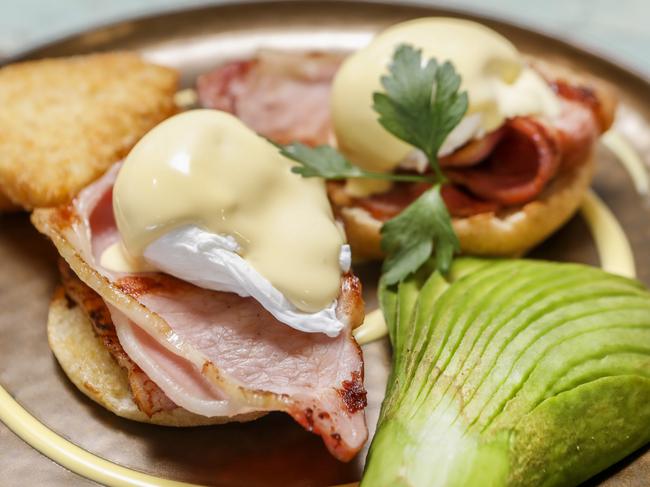 Le Vintage Boutique in Worongary wins best eggs benedict on the Gold Coast. Chef Guy Cox with is creation Eggs Benny with bacon, and owner Joel Aston in the background. Pic Tim Marsden