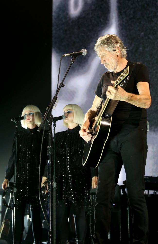 Singers Jess Wolfe and Holly Laeesig perform with Roger Waters in Brisbane. Picture: AAP Image/Steve Pohlner