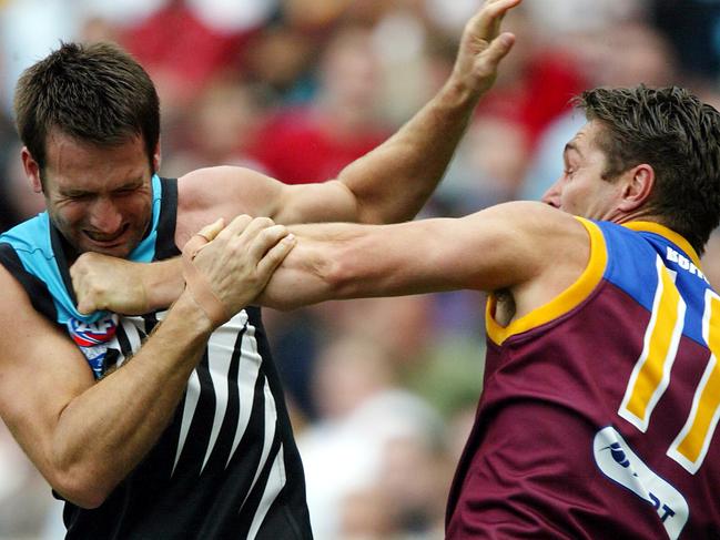 Alastair Lynch and Darryl Wakelin trade blows.