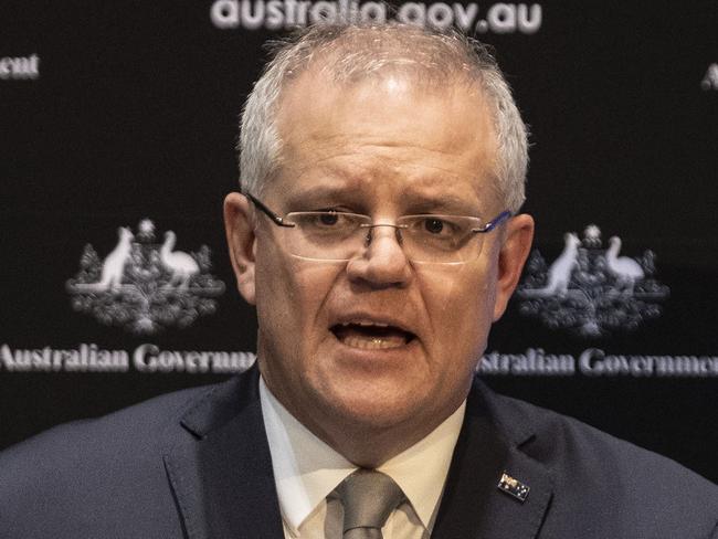 Prime Minister Scott Morrison with the Chief Medical Officer Brendan Murphy during a press conference at Parliament House in Canberra. Picture Gary Ramage