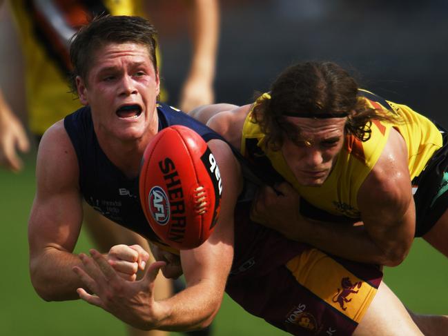 Cody Stackelberg feeds out a handball for Brisbane’s NEAFL side. Picture: Justin Kennedy