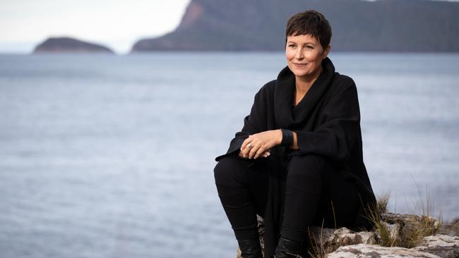 Author Heather Rose photographed on the coast with Bruny Island behind her. Picture: PETER MATHEW