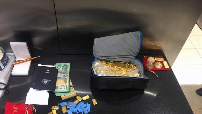 Eight kilograms of gold bullion from a vault at a secure premises, worth approximately $600,000, was secured in the raids. Source: Australian Federal Police