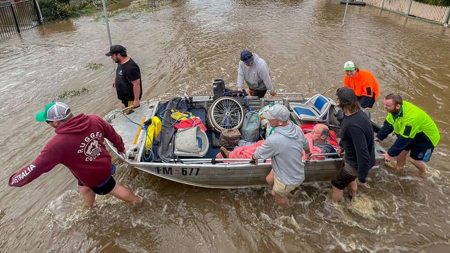 Kate Pianta and her husband Ray and dog Grace had to be rescued after the SES said they would not come back to get her if she didnÃt leave her dog. The dog is a rescue who is quite nervous. Locals helped rescue her with two boats , locals include Reece Causer  0497133287 (dark grey jumper) and Rick Windridge (in grey jumper) 0498726514Saturday 15th Rochester township floods from the Campaspe River as it rises through the streets. Picture: Jason Edwards