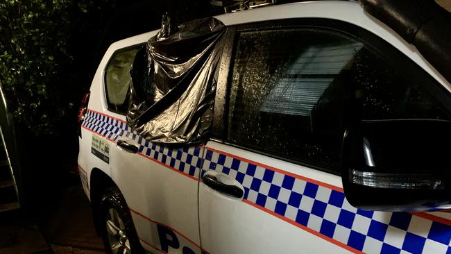 A police vehicle was damaged when the man was taken into police custody. Picture: Rae Wilson and Tara Miko