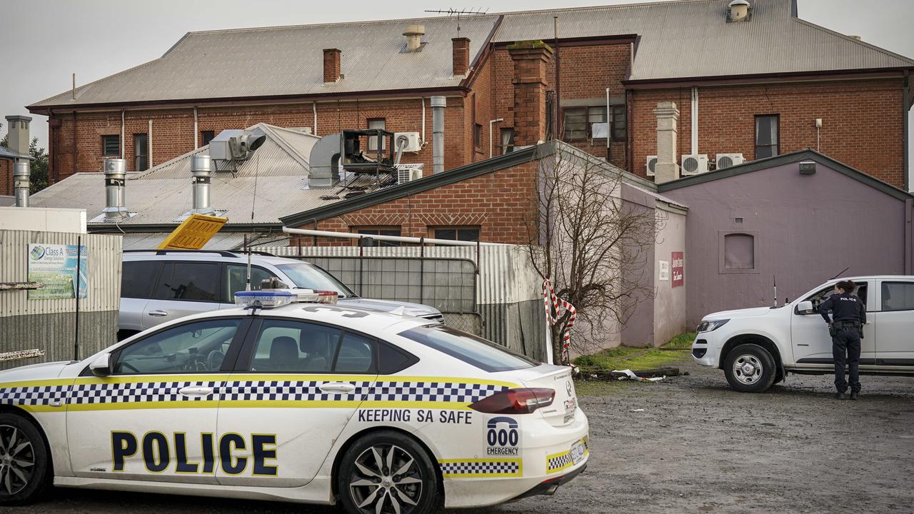 Police and fire investigators at the rear of Tanunda Hotel. Picture: Mike Burton/AAP