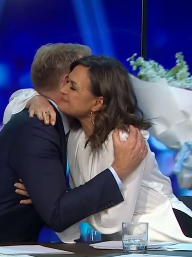 Hugging co-host Hamish Macdonald.