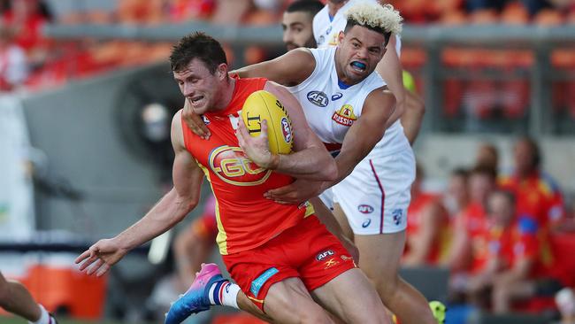 Pearce Hanley is tackled high by Jason Johannisen. Picture: Scott Fletcher