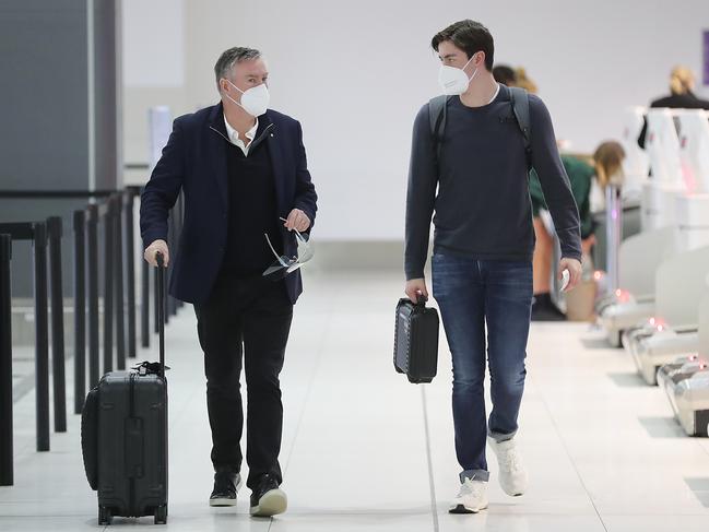 Collingwood president Eddie McGuire and his son before departing for Queensland. Picture: Alex Coppel.