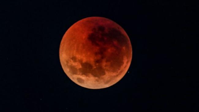 The blood moon over Sydney, Australia today. Picture: Nicholas Eagar