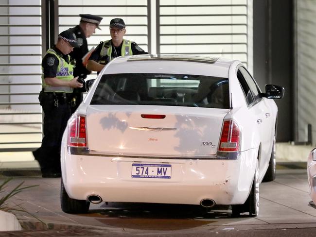 Police with the damaged stolen car in Angas St. Picture: Dean Martin