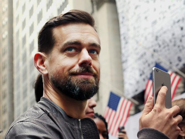 FILE: Jack Dorsey, chief executive officer of Square Inc., holds an Apple Inc. iPhone while standing outside of the New York Stock Exchange (NYSE) in New York, U.S., on Thursday, Nov. 19, 2015. Dorsey, the co-founder and chief executive officer of Twitter Inc., is stepping down, CNBC reported Monday. Photographer: Yana Paskova/Bloomberg