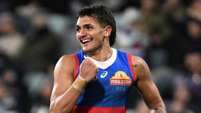 GEELONG, AUSTRALIA - JULY 20: Jamarra Ugle-Hagan of the Bulldogs celebrates kicking a goal during the round 19 AFL match between Geelong Cats and Western Bulldogs at GMHBA Stadium, on July 20, 2024, in Geelong, Australia. (Photo by Daniel Pockett/Getty Images)