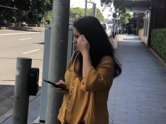 Kanishka Chaudhari, 24, of North Sydney, outside Manly Local Court on Thursday, February 22, where she is facing 14 counts of dishonestly obtain property by deception for allegedly taking money from Camperdown Cellars. Picture: Manly Daily