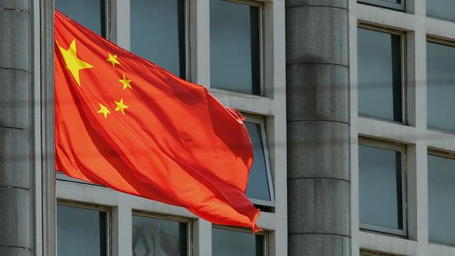 The Chinese national flag is seen on a flagpole.