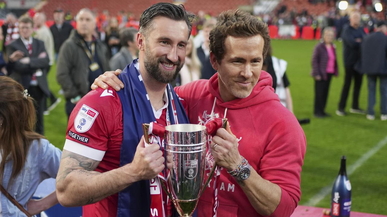 Ryan Reynolds and Wrexham's Ollie Palmer after the club won promotion to the Championship. Picture: AP