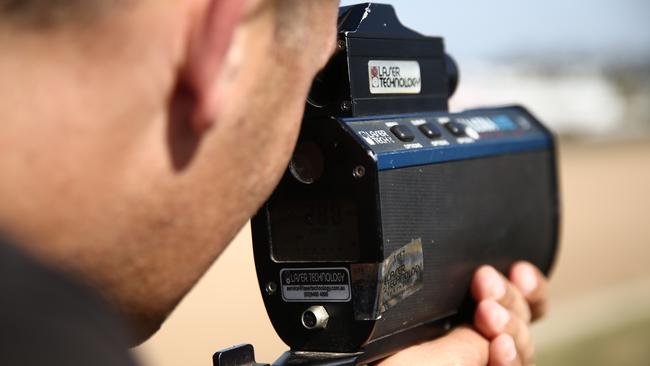 V8 SUPERCARS - SUPERCHEAP AUTO BATHURST 1000. Pictured is reporter Nick Walshaw recording speeds at the chase with a radar gun, at Mount Panorama Raceway in Bathurst today at the Bathurst 1000. Picture: Tim Hunter.