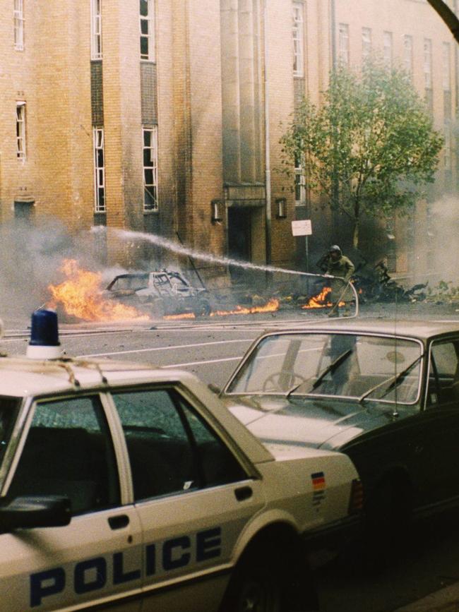 A car burning after a bomb exploded in Russell Street.