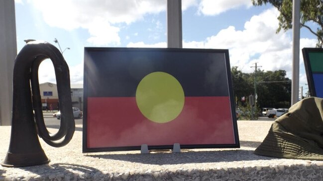 Mic Noble’s tribute at the Logan war memorial, where the service was cancelled but he organised a video tribute. (AAP/Image Sarah Marshall)