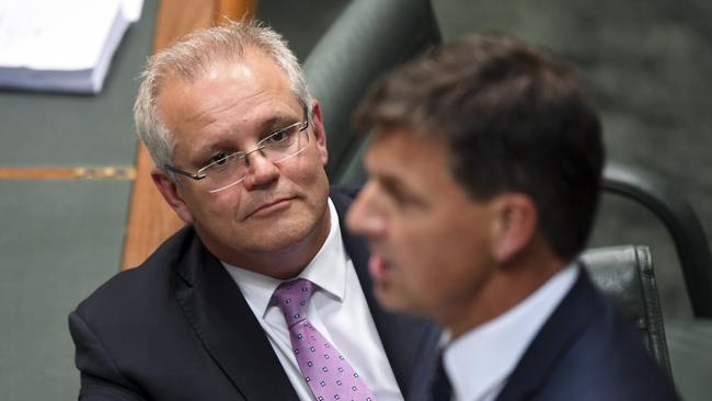 Prime Minister Scott Morrison listens to Energy Minister Angus Taylor during House of Representatives Question Time at Parliament House on Tuesday.