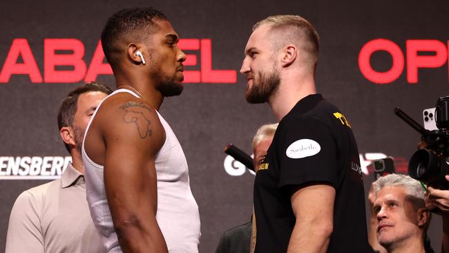 Anthony Joshua and Otto Wallin face off. Photo by Richard Pelham/Getty Images.