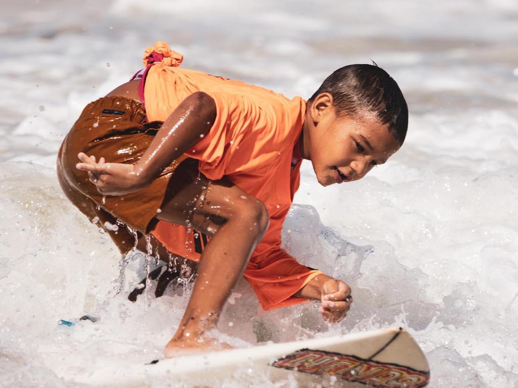 Naru Goori Groms is a surfing group for young Indigenous people to learn about mental health and suicide prevention. Picture: Jordan Goode