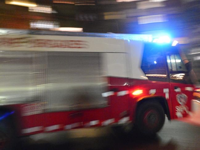 Fire Brigade on a false alarm. Up to 6 units called to housing commission on Moorehead st Redfern. Fire truck, fire engine, fire department. Generic. Photographed with: Nikon D4