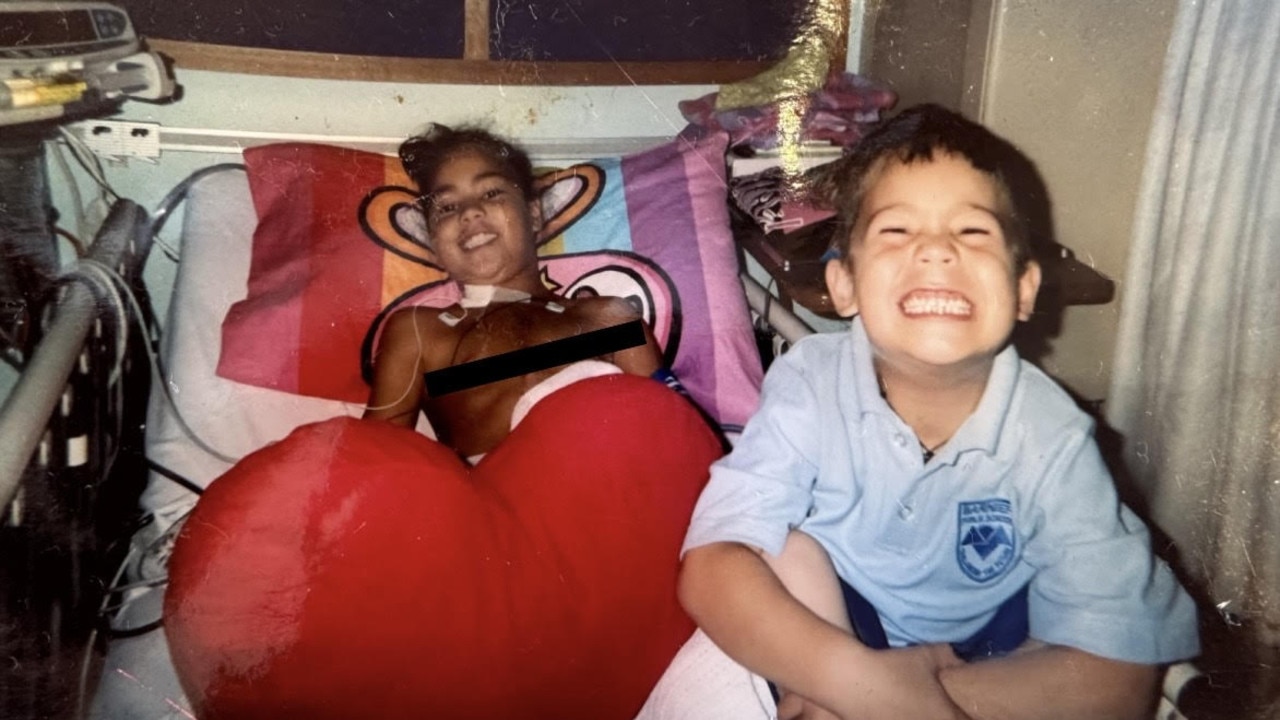 Kennedy Cherrington, aged eight, recovers after her open heart surgery, pictured here with brother Winniata Cherrington.