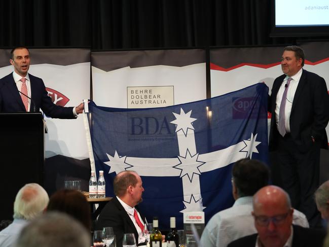 07/02/2019: (L-R) Stephen Galilee from NSW Minerals Council presents Adani Australia CEO Lucas Dow with a Eureka flag after speaking at the Sydney Mining Club lunch on Thursday. Hollie Adams/The Australian