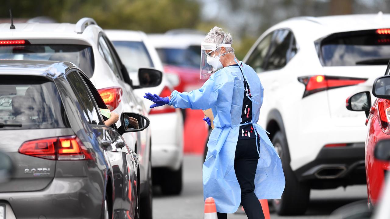 A health worker processes members of the public at a drive-through Covid-19 testing clinic at Murarrie in Brisbane. Picture: NCA NewsWire / Dan Peled