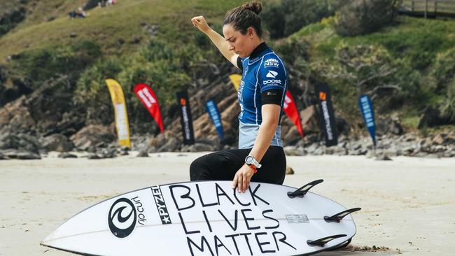 Tyler Wright takes a knee in solidarity with the Black Lives Matter movement at the Tweed Coast Pro. - WSL / MATT DUBAR