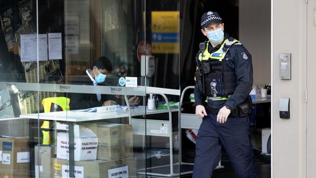 A police officer leaves the Brady Hotel in Melbourne CBD. Picture: NCA NewsWire / David Geraghty