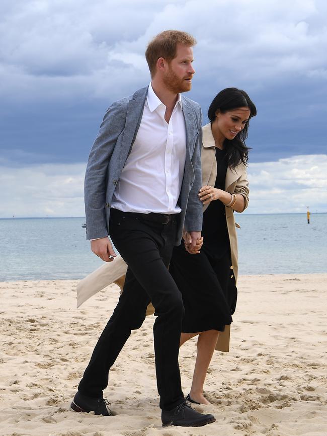 The royal couple set against a typically gloomy Melbourne sky. Picture: AAP