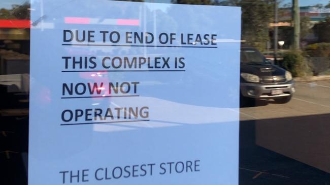 A note on the door of the former Harvey Norman store at Ormiston.