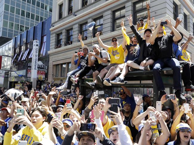 Warriors celebrate championship, mingle with fans in colorful parade
