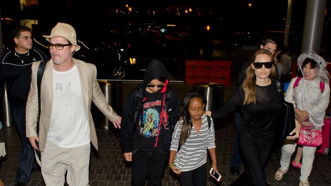 Brad Pitt, Maddox Jolie-Pitt, Zahara Jolie-Pitt and Angelina Jolie are seen at LAX in June 2014 in Los Angeles, California. Picture: GVK/Bauer-Griffin/GC Images)