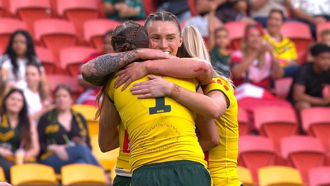 Julia Robinson and Tamika Upton celebrate a Jillaroos try.