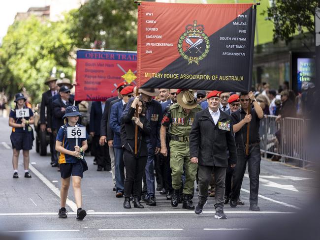 The Military Police Association of Australia make their way through the streets for the ANZAC Day parade, Brisbane city.