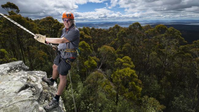 Philip Harris, who runs Aardvark Adventures, abseils near The Springs on Mount Wellington, Hobart. Picture: Matthew Newton