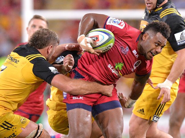 BRISBANE, AUSTRALIA - APRIL 01: Reds player Samu Kerevi attempts to break away from the defence during the Super Rugby round six match between the Reds and the Hurricanes at Suncorp Stadium on April 1, 2017 in Brisbane, Australia.  (Photo by Bradley Kanaris/Getty Images)