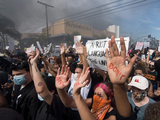 Demonstrators face off with police in the Fairfax District of Los Angeles. Picture: AFP