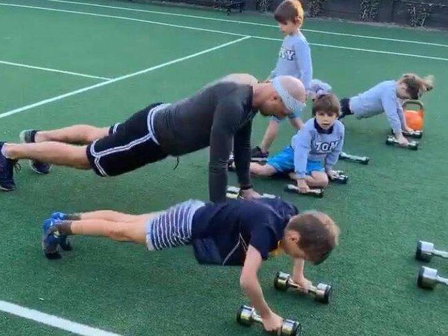 ‘Mr Judd’ takes phys-ed class at home with his kids. Picture: Bec Judd/Instagram