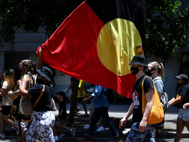 BRISBANE, AUSTRALIA - NewsWire Photos - JANUARY 26, 2021.Protesters take part in an Invasion Day march through central Brisbane. As the nation marks this day as Australia Day, indigenous groups and their supporters refer to it as Invasion Day or Survival Day.Picture: NCA NewsWire / Dan Peled