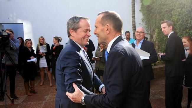 Prime Minister Tony Abbott holds a press conference at H C Coombs Centre in Kirribilli where he met with Opposition Leader Bill Shorten and leaders from the Indigenous community to discuss changes to the constitution. Tony Abbott (R) and Bill Shorten shake hands. Picture: Toby Zerna