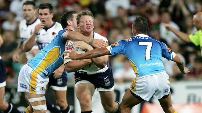 Brisbane's David Stagg hit high by at left Brett Delaney while Scott Prince. (AAP Image/Colin Whelan/Action Photographics)